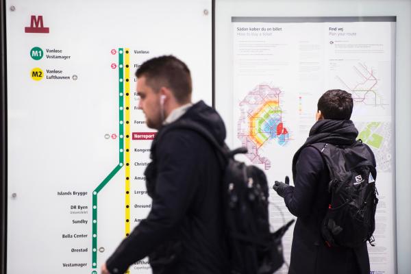 2 men at a metro station